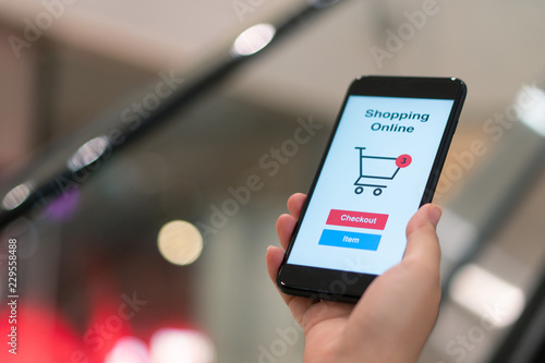 Online shopping with smartphone and shopping bags delivery service using as background shopping concept and delivery service concept with copy space for your text or design.