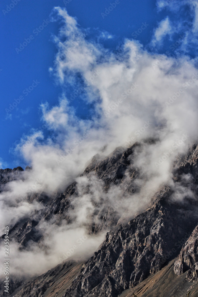 Live cloud formation on the mountain sides.