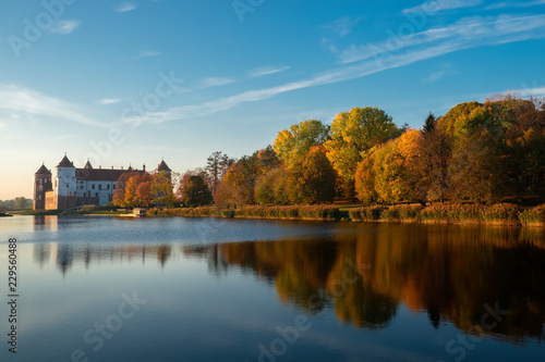 Old autumn park and pond in Mir township, Grodno region, Belarus.
