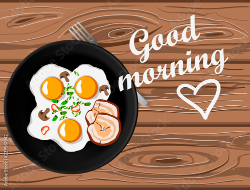 Fried eggs and bacon top view on wooden table with good morning lettering. Home made breakfast with love