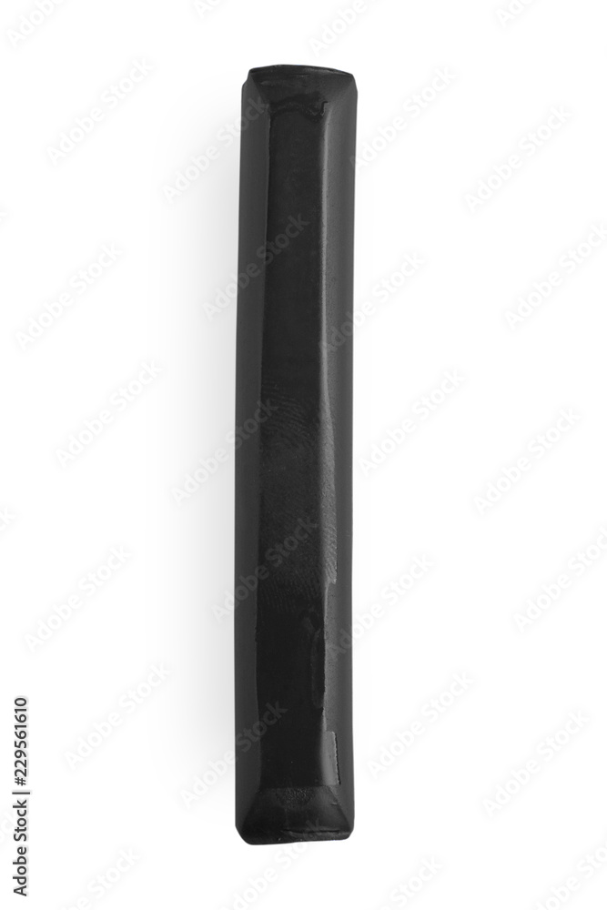 black piece of plastic on a white background black piece of plastic on a white background