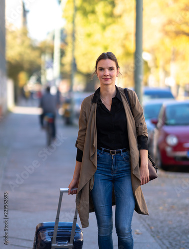 Young woman with suitcase