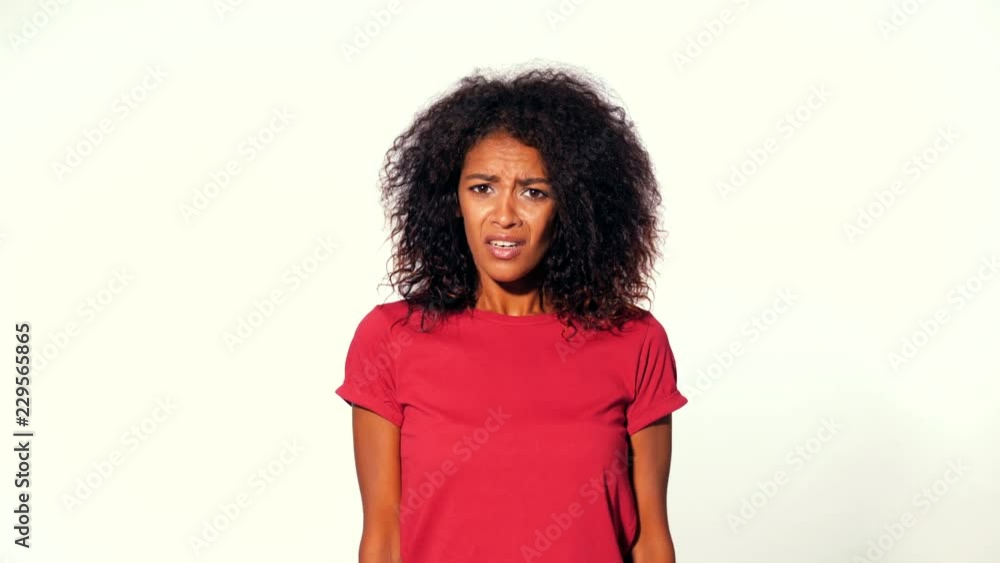 Angry annoyed woman raising hand up to say what. Misunderstanding, disagreement, unpleasant surprise. Afro girl facial expressions, emotions and feelings. Body language. Angry annoyed woman raising hand up to say what. Misunderstanding, disagreement, unpleasant surprise. Afro girl facial expressions, emotions and feelings. Body language.