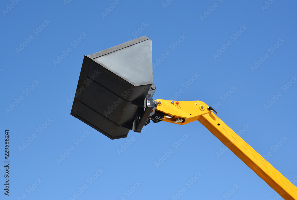 Bulldozer lifting bucket. Excavator bucket with copy space.