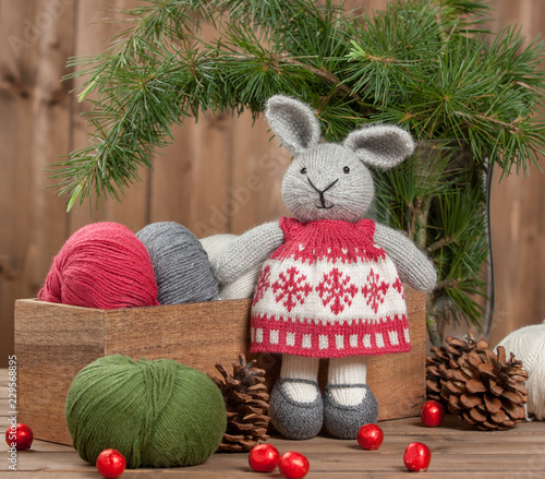 Handmade Knitted Rabbit Soft Toy In Christmas Dress. Yarn Balls.