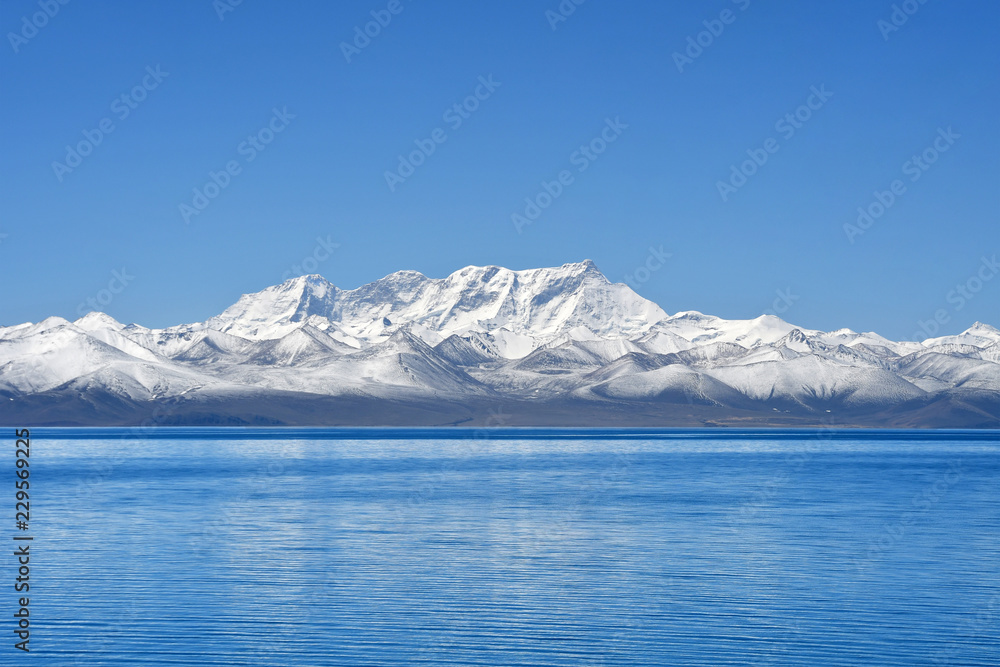 Tibet, lake Nam-Tso (Nam Tso) and Nyechen Tangla mountain in sunny day