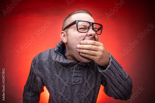 Nacrolepsy man yawning because he is absolutly exhausting photo