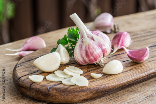 Garlic bulb and garlic cloves  on the wooden table.