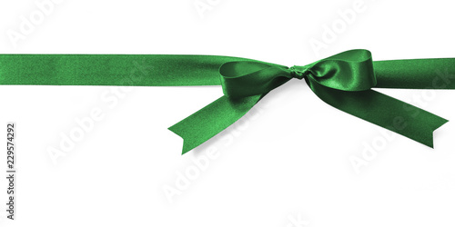Green satin bow ribbon emerald kelly jade Christmas color stripe fabric bow isolated on white background with clipping path