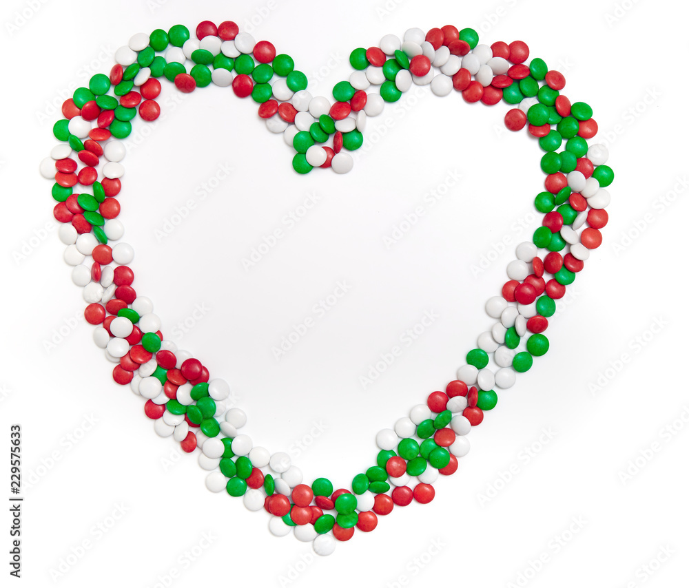 Heart of chocolate candies of Christmas colors