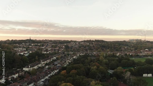 Aerial ascending view of a typical Edwardian village in North London at sunset photo