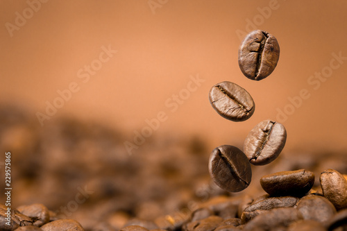 Coffee beans falling on pile