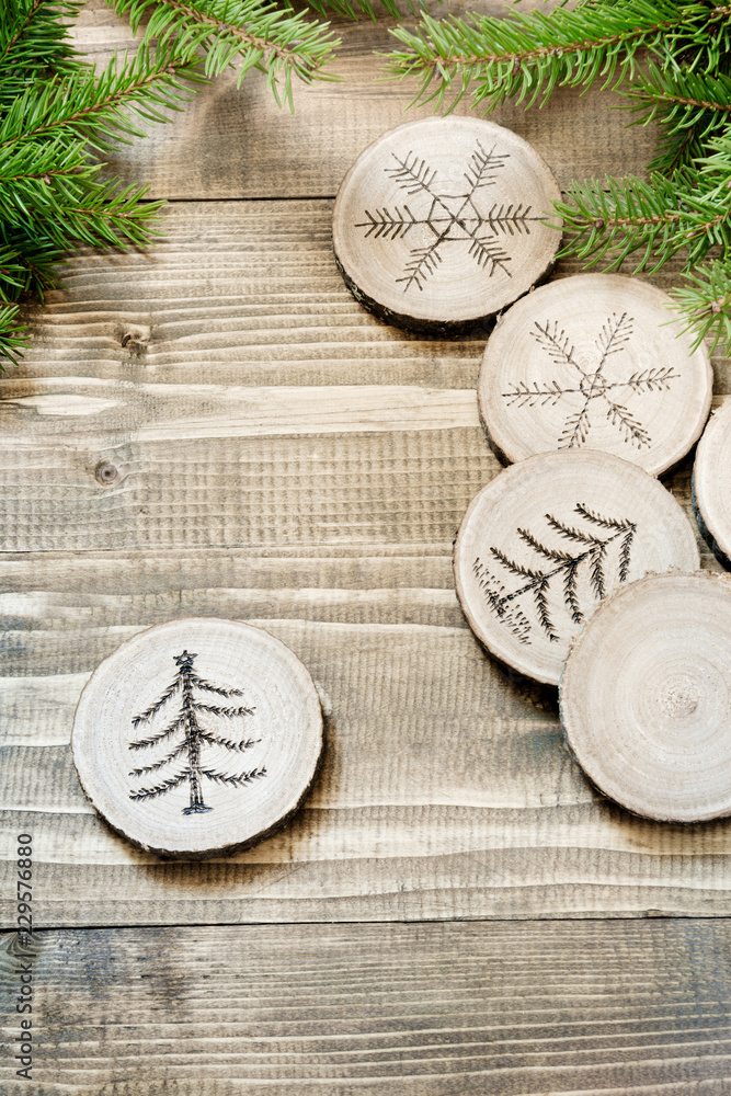 Christmas homemade pyrography toys. Wooden slice. Alternative decor. Christmas decorations. Close up. Christmas homemade pyrography toys. Wooden slice. Alternative decor. Christmas decorations. Close up.
