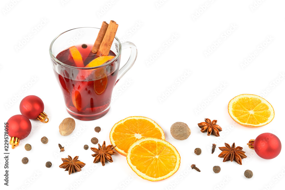 Hot red mulled wine isolated on white background with christmas spices, orange slice, anise and cinnamon sticks, close up. Hot red mulled wine isolated on white background with christmas spices, orange slice, anise and cinnamon sticks, close up.