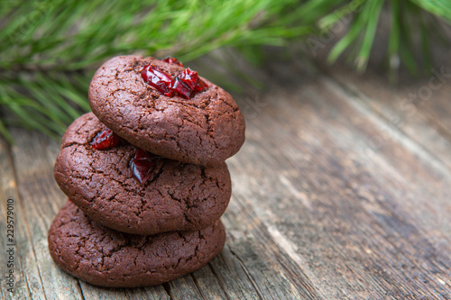 Hommede freshly baked chocolate cookies on wooden background photo