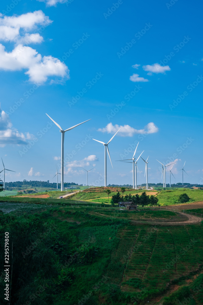 clean energy turbine farm with a hut and crop farm clean energy turbine farm with a hut and crop farm