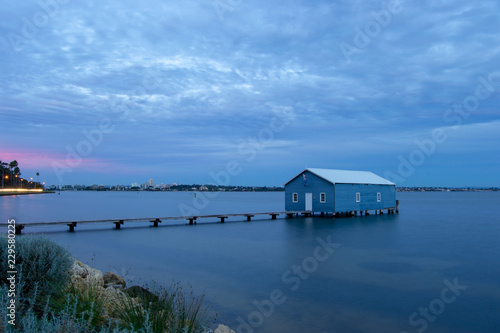 Blue Boat House In Perth at cloudy sunset © Maria