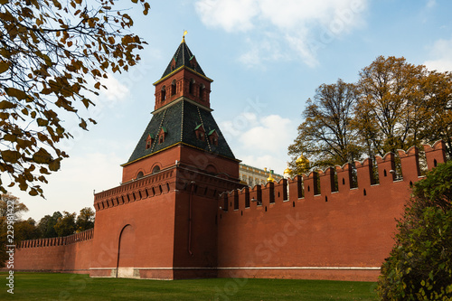 Moscow Kremlin wall of red brick. Tainitskaya tower photo