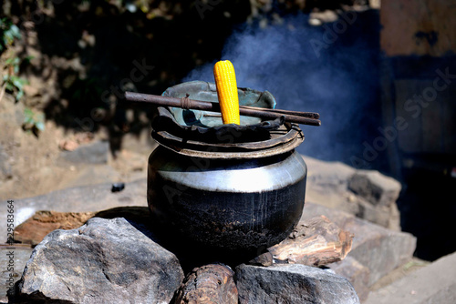Sri Lanka. Ella region, cooking corn for tourists