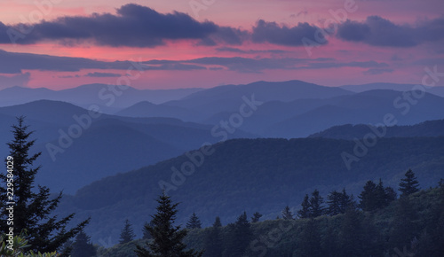 Great Smoky Mountains National Park, North Carolina, USA - July 4, 2018: Mountain layers full of colorful foliage right after sunset in the Great Smoky Mountains photo