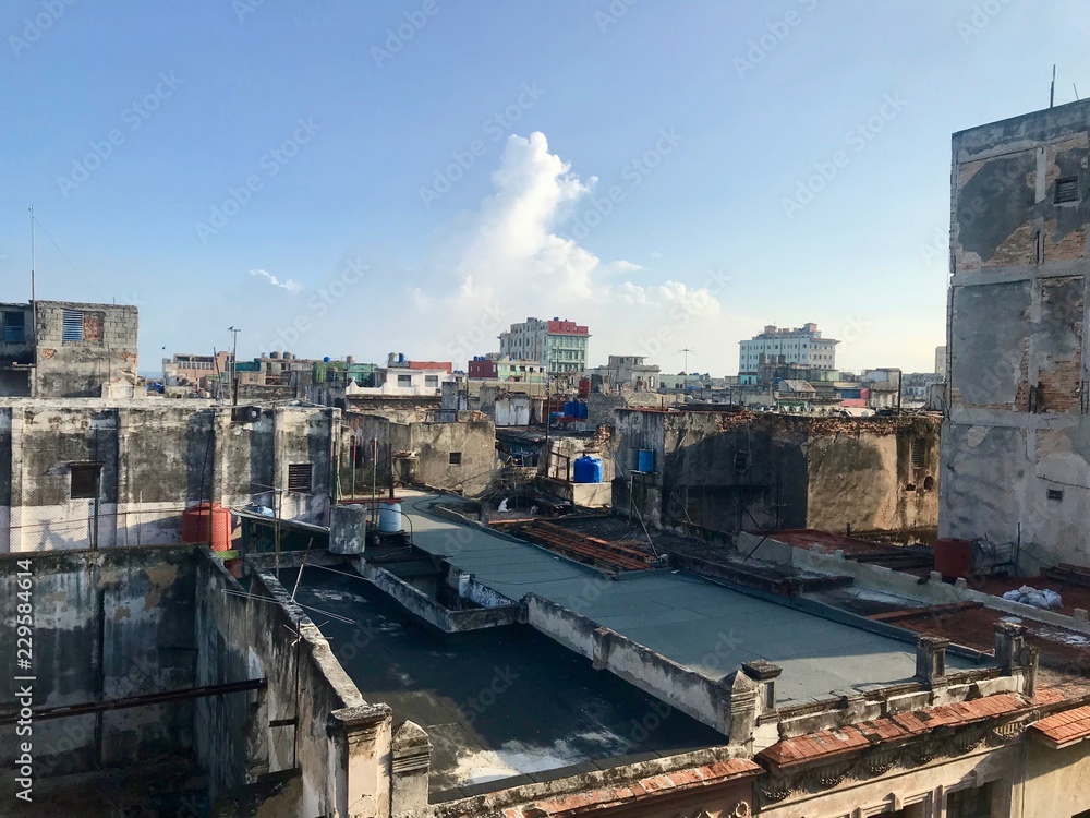 Scenic panoramic view in the sunrise morning hours over the roofs of Havana (Habana) city, capital of the Caribbean island of Cuba and a tourist destination with a vintage latin downtown neighborhood