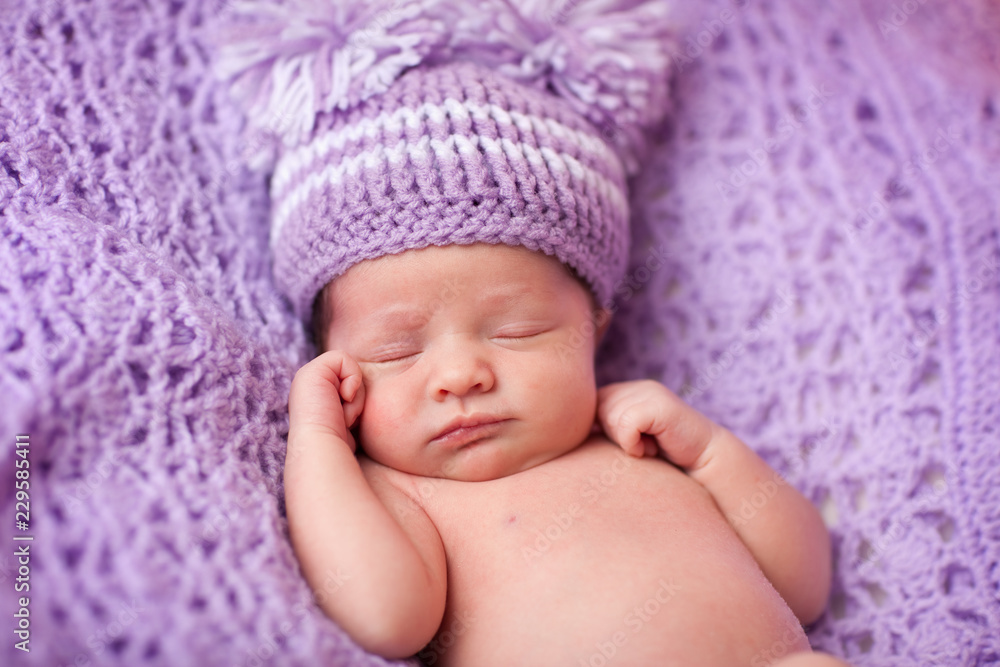 Sleeping Newborn Baby Girl in Purple Knit Hat Sleeping Newborn Baby Girl in Purple Knit Hat