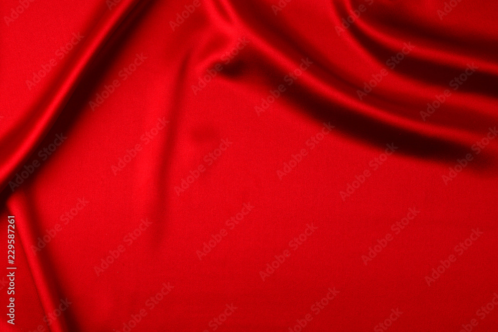 Red silk or satin luxury fabric texture can use as abstract background. Top view Red silk or satin luxury fabric texture can use as abstract background. Top view