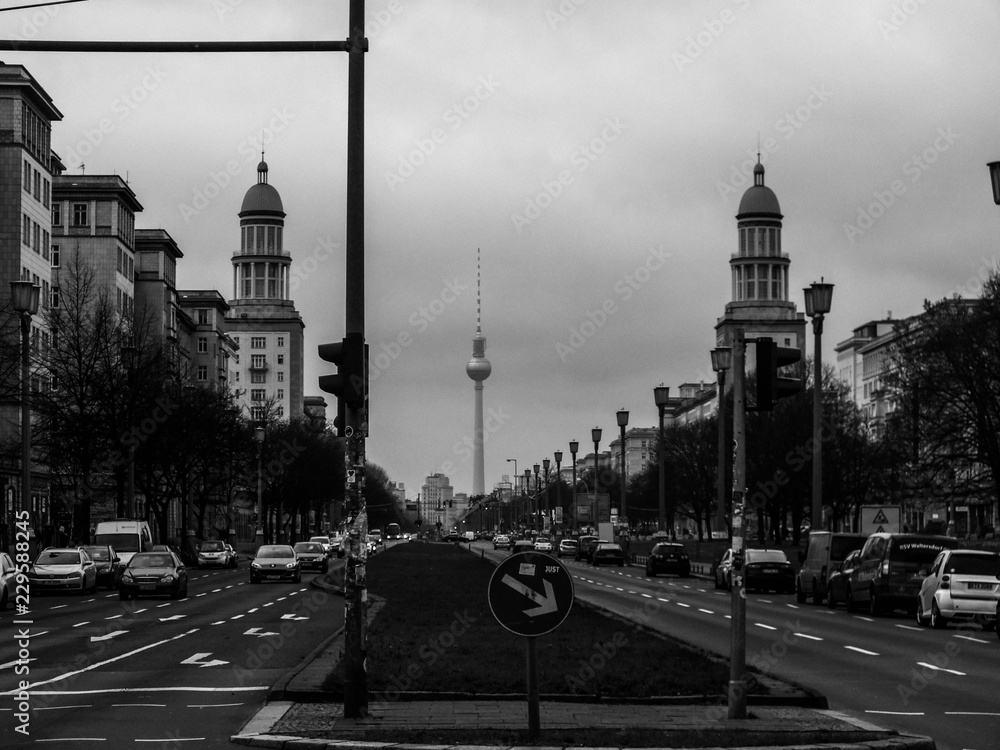 View over Frankfurter Allee to Fernsehturm in Berlin in black and white