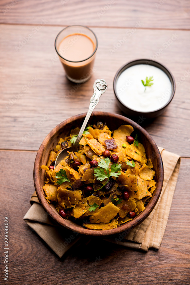 Homemade Kothu Parotta/ Paratha or Stir Fried Leftover Chapati Masala or fodnichi poli in marathi, served in a bowl or plate with curd and hot tea. Selective focus Homemade Kothu Parotta/ Paratha or Stir Fried Leftover Chapati Masala or fodnichi poli in marathi, served in a bowl or plate with curd and hot tea. Selective focus