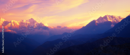 Beautiful panoramic view of a mountain range in the Himalayas during sunset
