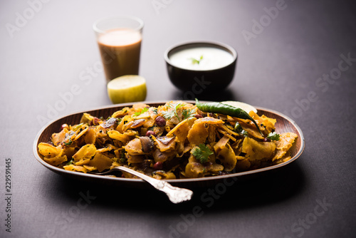 Obraz na plátně Homemade Kothu Parotta/ Paratha or Stir Fried Leftover Chapati Masala or  fodnichi poli in marathi, served in a bowl or plate with curd and hot tea