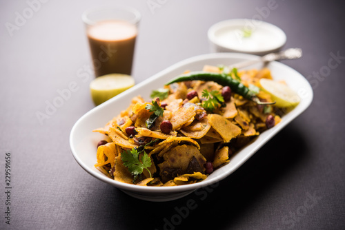 Homemade Kothu Parotta/ Paratha or Stir Fried Leftover Chapati Masala or fodnichi poli in marathi, served in a bowl or plate with curd and hot tea. Selective focus