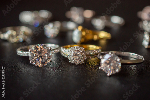 Jewelry diamond rings set on black background close up