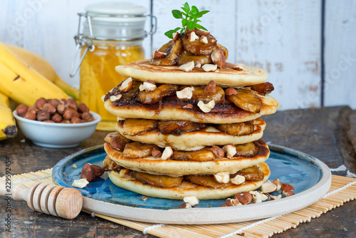 Chocolate-filled pancakes with caramelised bananas, honey and hazelnuts