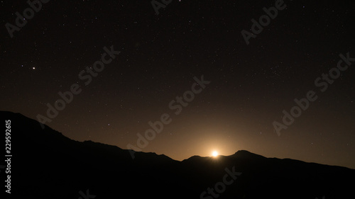 Starry night with moon setting beneath the mountains  Artvin  Turkey
