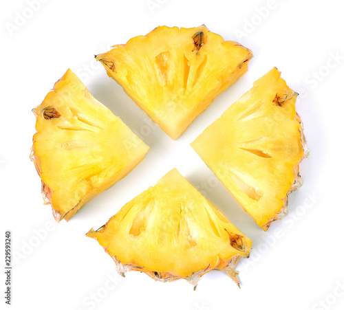 Top view of pile of sliced pineapple isolated on white background