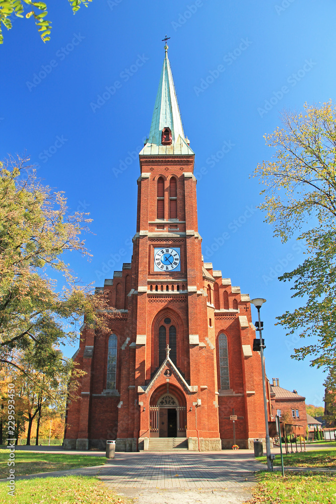old church made of orange bricks on sunny autumn day, Trinec, Czech Republic
