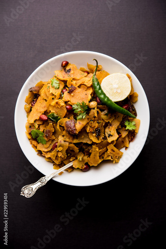 Homemade Kothu Parotta/ Paratha or Stir Fried Leftover Chapati Masala or  fodnichi poli in marathi, served in a bowl or plate with curd and hot tea. Selective focus photo