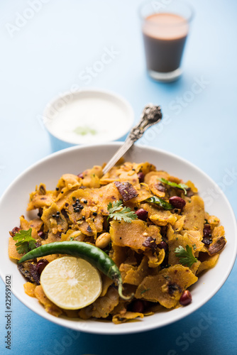 Homemade Kothu Parotta/ Paratha or Stir Fried Leftover Chapati Masala or  fodnichi poli in marathi, served in a bowl or plate with curd and hot tea. Selective focus photo