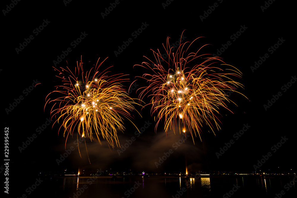 Red and golden explosions of fireworks show in the night Red and golden explosions of fireworks show in the night