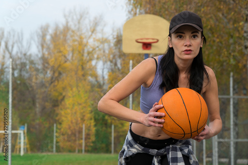 ball 2 play basketball. hands. girl basketball. outdoors.