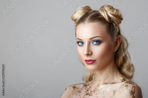 portrait of beautiful blonde woman with makeup beauty photoshoot on background
