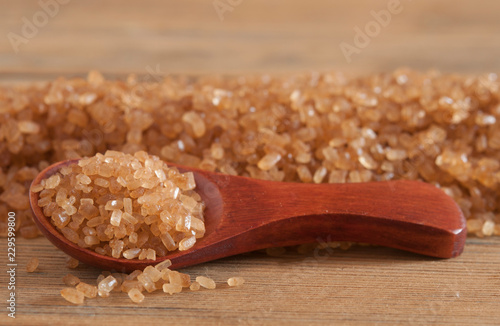 brown sugar heap and wooden spoon