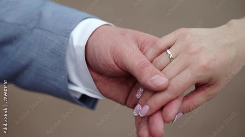 Man and woman taking and holding hands to take care and help each other. Help and sharing ideas. Lovely couple at dating or wedding Man and woman taking and holding hands to take care and help each other. Help and sharing ideas. Lovely couple at dating or wedding