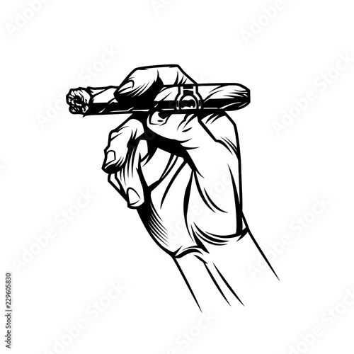 Male hand holding burning cuban cigar
