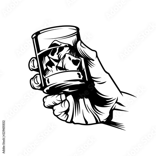 Male hand holding glass of whiskey