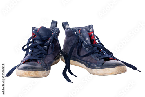 Old worn blue boy shoes.