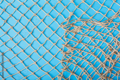 Fishing net over blue background 