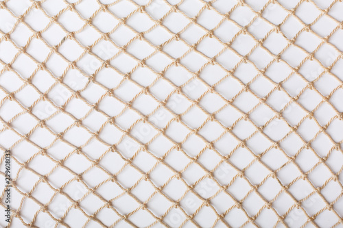 Fishnet on white background. Fishing net. Texture fishnet, seine. Dragnet, drag, trammel, sweep-net