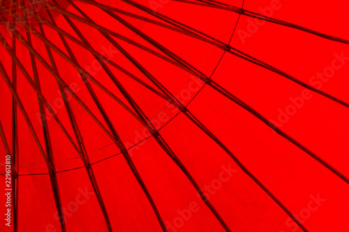 closeup detail of under the red antique umbrella of north of thailand